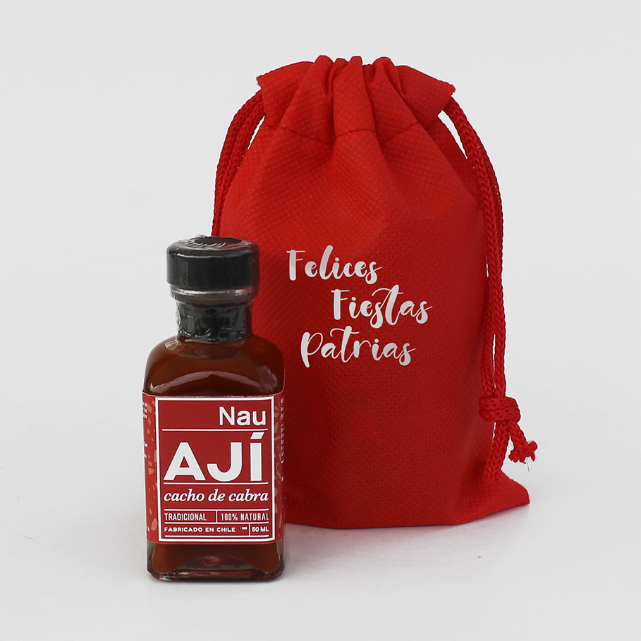 Ají Espinero Nau de 50 ml en variedades tradicional, merkén, verde o extra picante. Presentado en saquito TNT reutilizable con logo corporativo.