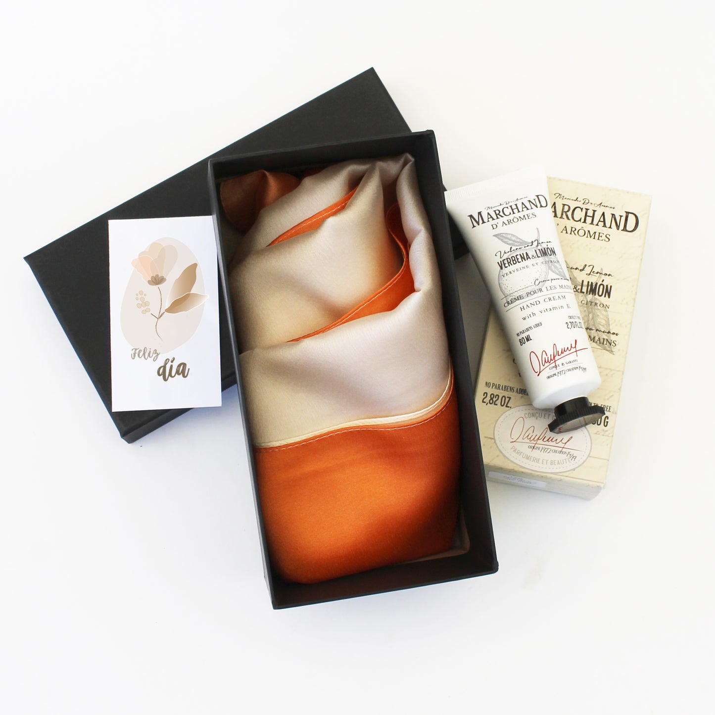 “Regalo Suave Esencia con pañuelo de seda bicolor y crema de manos Marchand de Arômes – Aporta Imagen Chile”