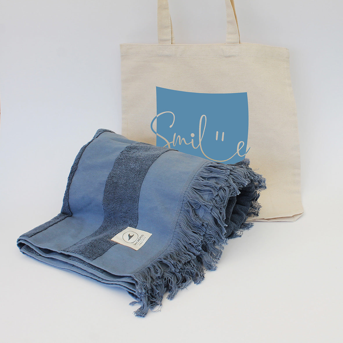 “Regalo Ritual de Verano con toalla de playa Dryhood y bolsa de algodón – Aporta Imagen Chile”