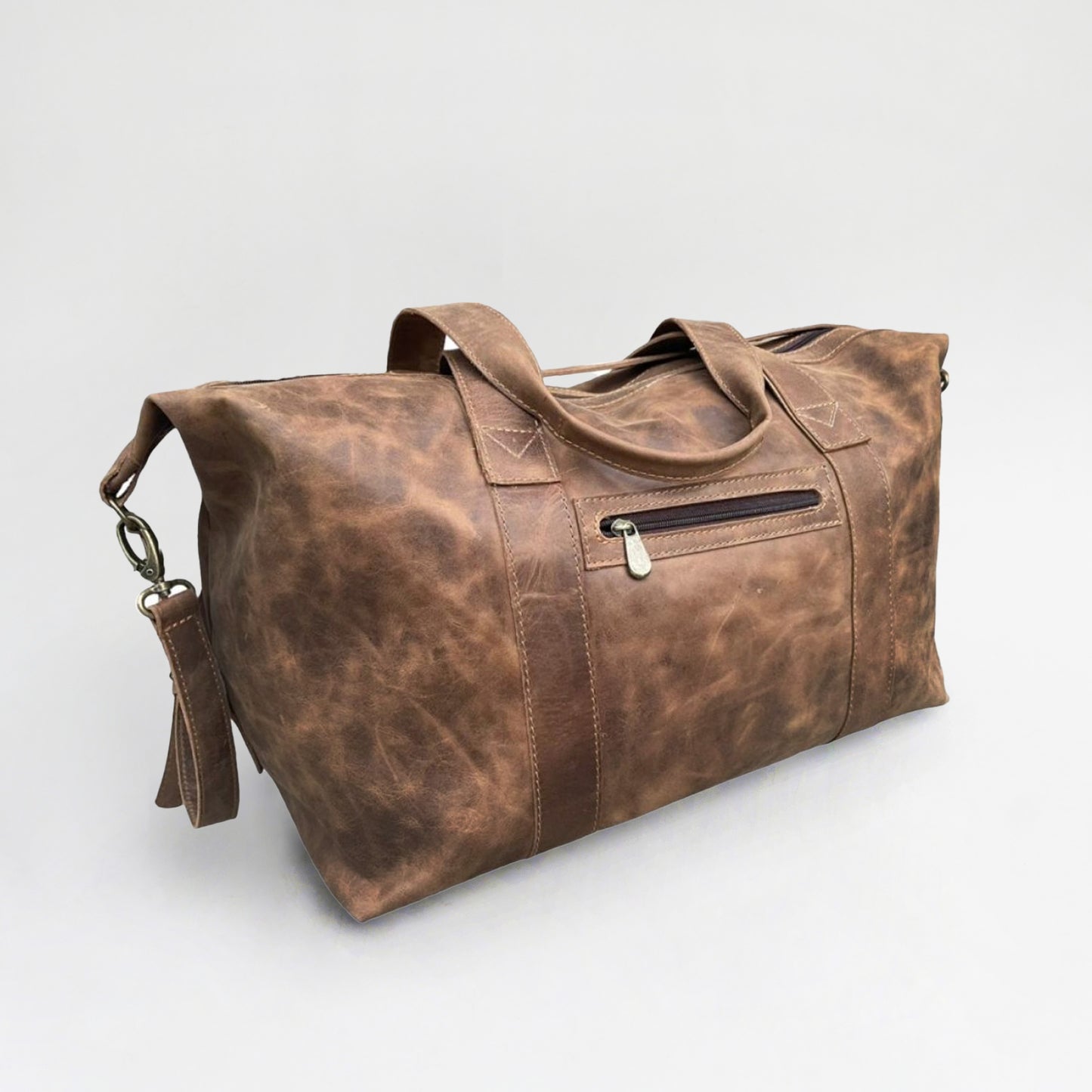Bolso en cuero natural, doble manilla y doble carro. 50x30x25 cm. Ideal para viaje de fin de semana. Regalo corporativo premium.