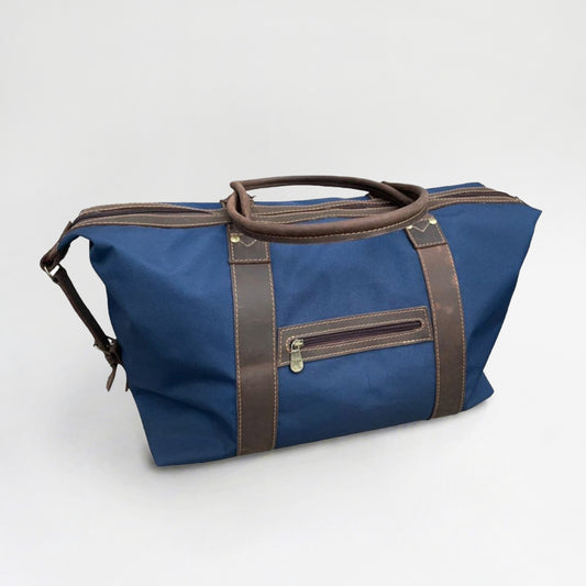 Bolso de tela con aplicación en cuero y doble manilla. 48x32x18 cm. Versátil para viajes y uso diario. Regalo corporativo premium.