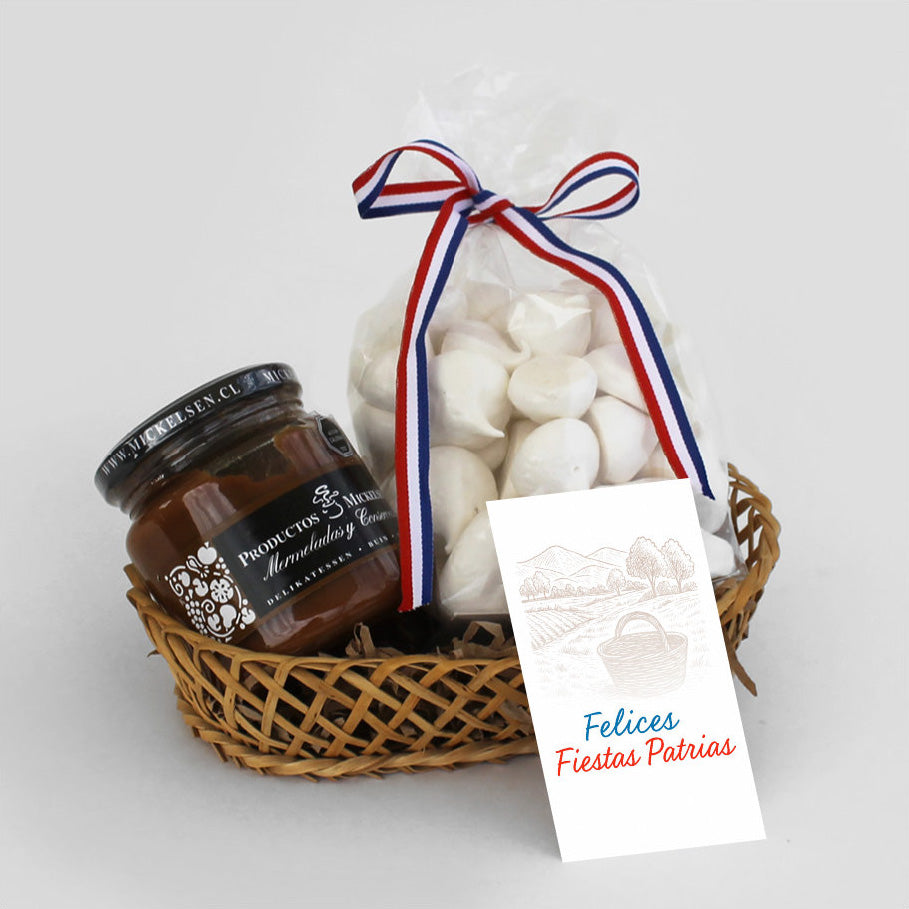 Encantadora canasta de mimbre con dulce de leche artesanal y merenguitos. Un regalo corporativo dulce y memorable, ideal para celebraciones y reconocimientos.