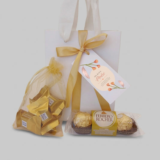 Sorprende a tus colaboradoras con nuestro Pack "Distinción para Mamá". Incluye Ferrero Rocher, Ritter Sport Gold y tarjeta con el logo de tu empresa. Presentación de lujo lista para entregar. Pedido mínimo 100 unidades. ¡Cotiza hoy el regalo perfecto!