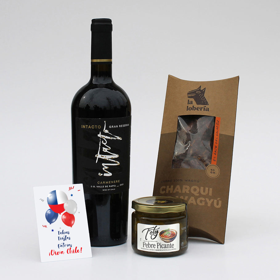Set gourmet con vino Intacto Gran Reserva, charqui artesanal y pebre picante. Un regalo corporativo con identidad, tradición y sabores auténticos para compartir.