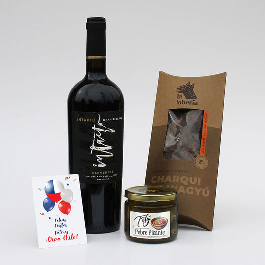 Set gourmet con vino Intacto Gran Reserva, charqui artesanal y pebre picante. Un regalo corporativo con identidad, tradición y sabores auténticos para compartir.